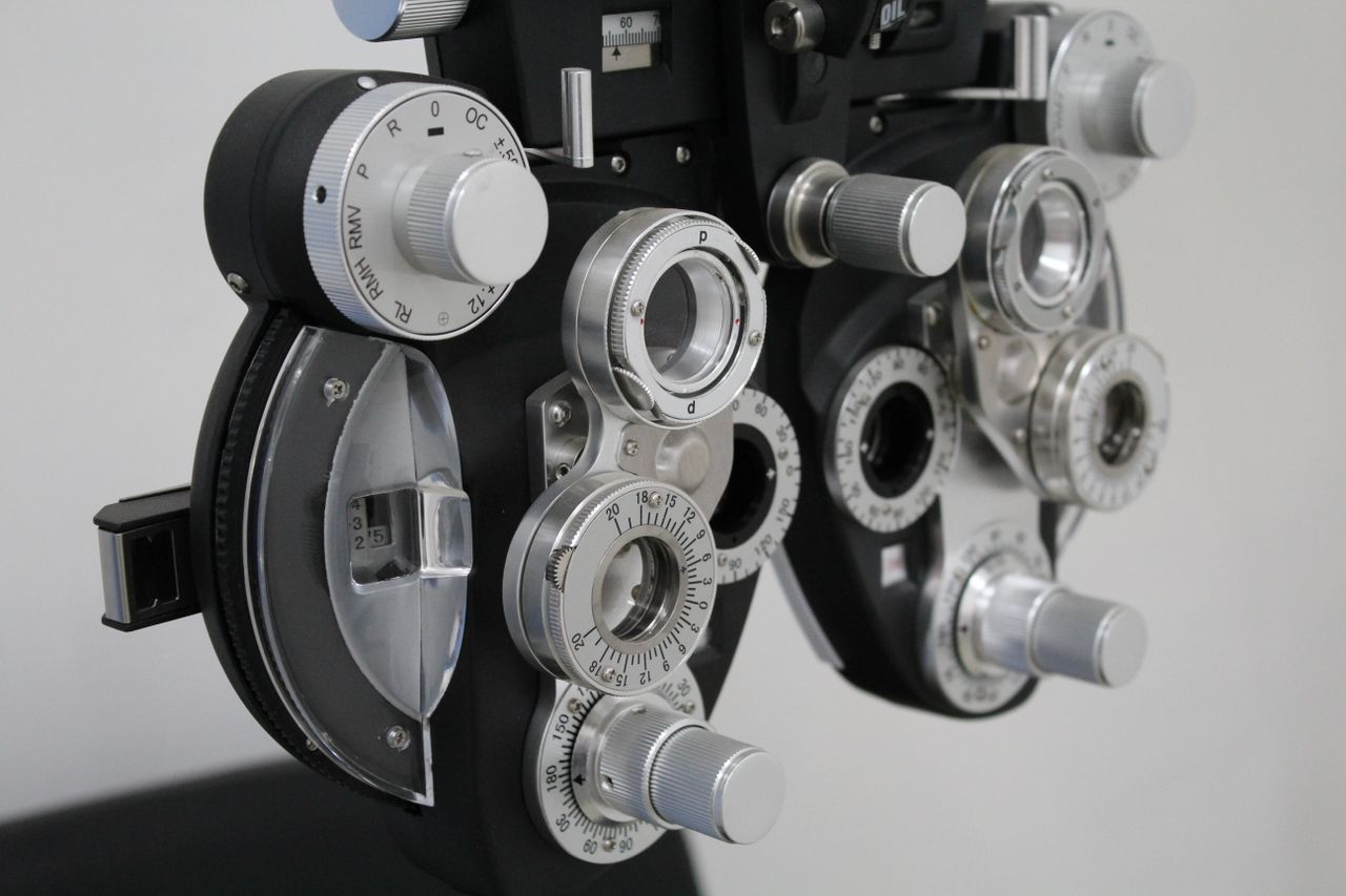 services-02 Close-up photo of a phoropter, essential equipment for eye exams.